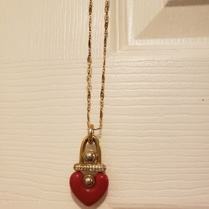 Red heart in lock pendant